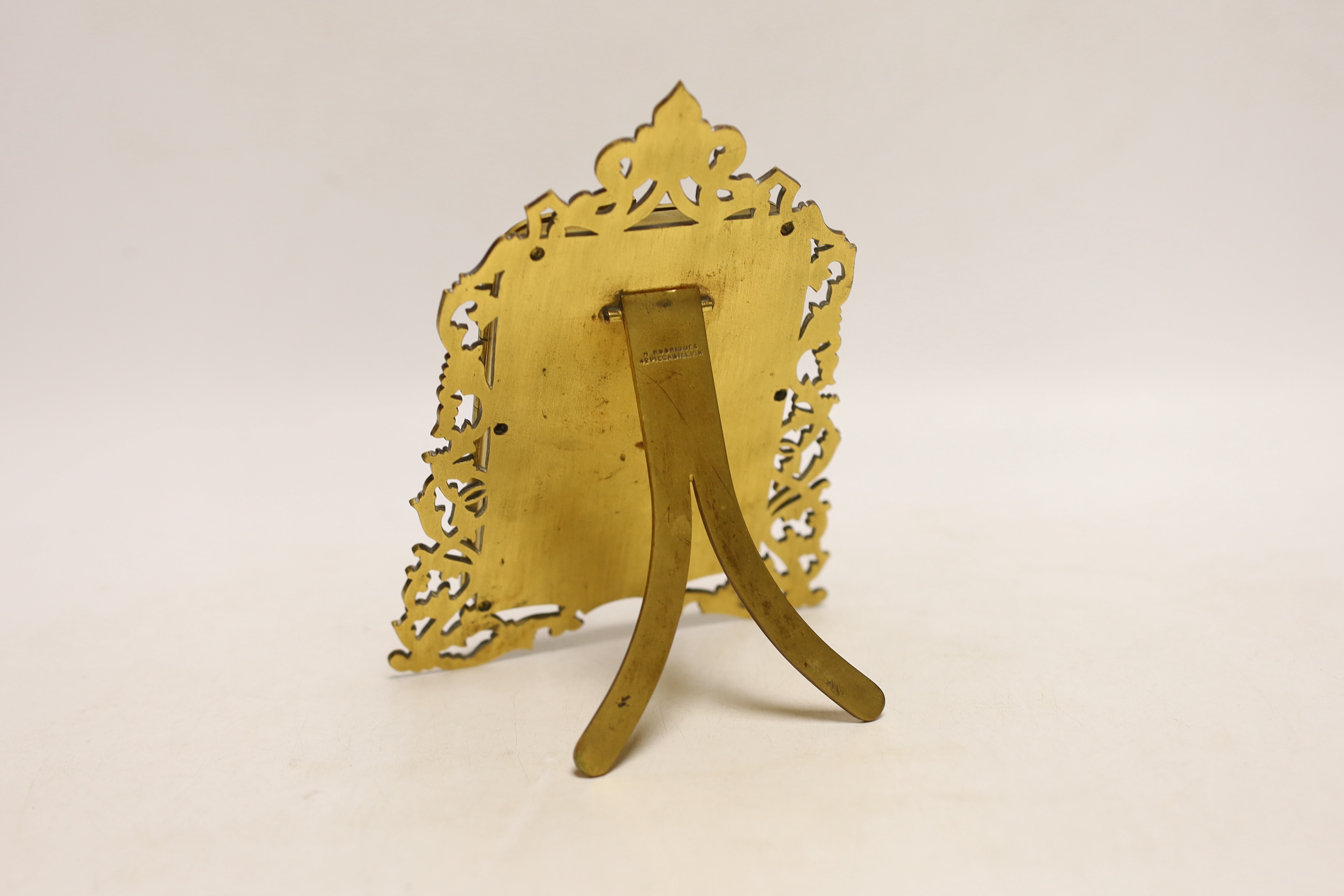 A French Palais Royale easel enamel plaque, inscribed ’’Fontaine de L'amitie’’ [fountain of friendship], retailed by Rodrigues of Piccadilly, 16.5cm high